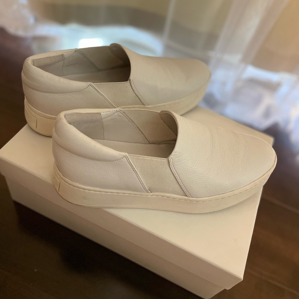 Vince women slip ons . White leather on top , used.